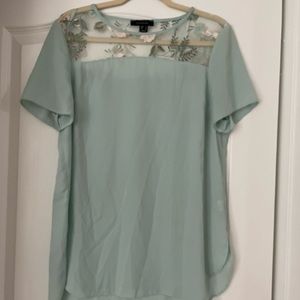 Turquoise blouse with light pink flowers